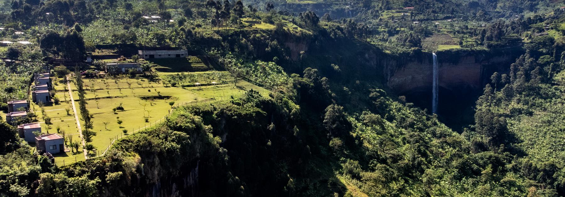 Sipi Valley Resort with a drone view of the lodge and the Sipi Falls